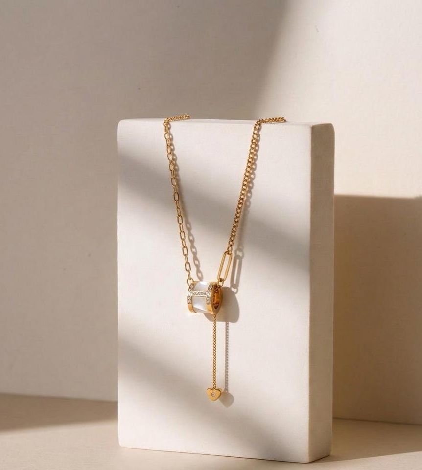 Gold adjustable slider necklace with heart charm from Prifine, featuring a delicate chain and elegant jewelry design.