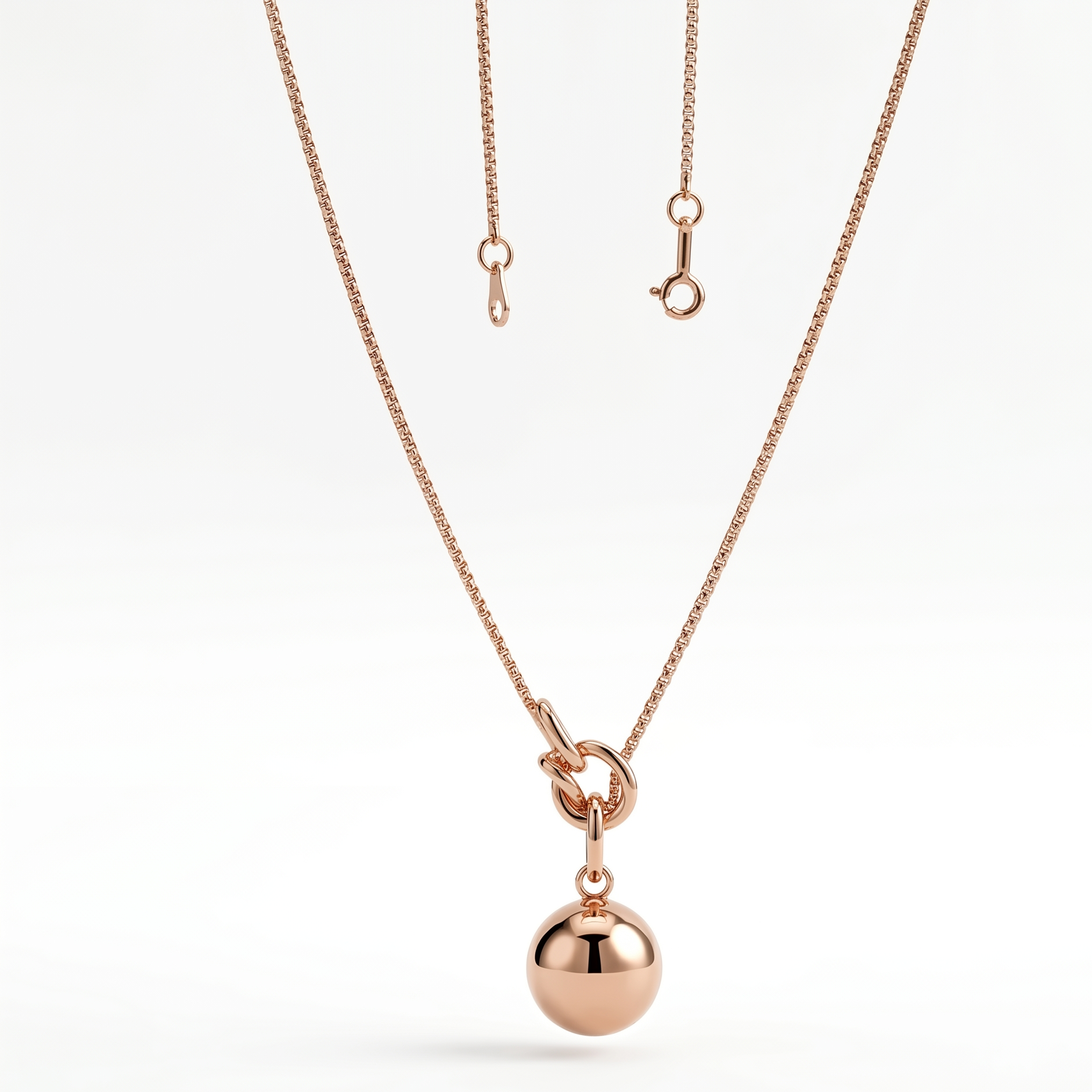 Rose gold knot and sphere pendant necklace by Prifine, showcasing a delicate jewelry piece with a polished, elegant finish.