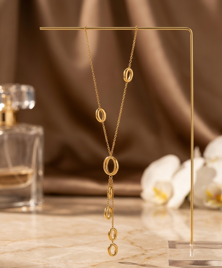 Gold drop pendant necklace by Prifine featuring dangling circular charms on a delicate chain.