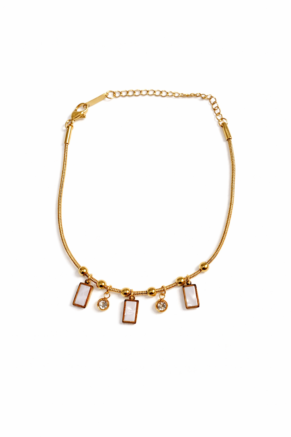 Gold plated charm bracelet by Prifine featuring various decorative charms on a delicate chain.