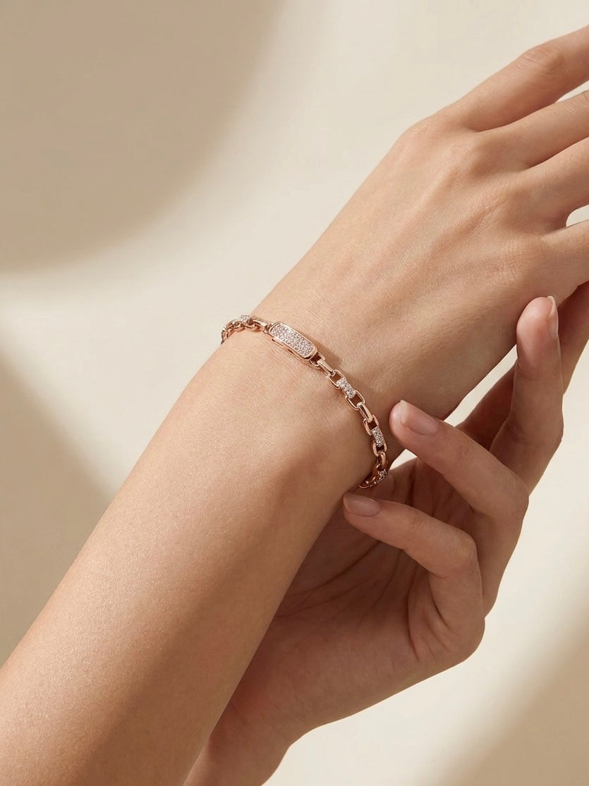 Prifine 18k gold-plated champagne mixed-cut tennis bracelet with sparkling gemstones on a jewelry display.