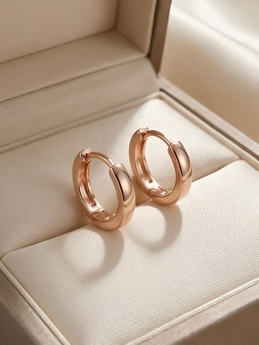 Prifine classic rose gold hoop earrings with a smooth, polished finish and medium size, displayed on a neutral background.