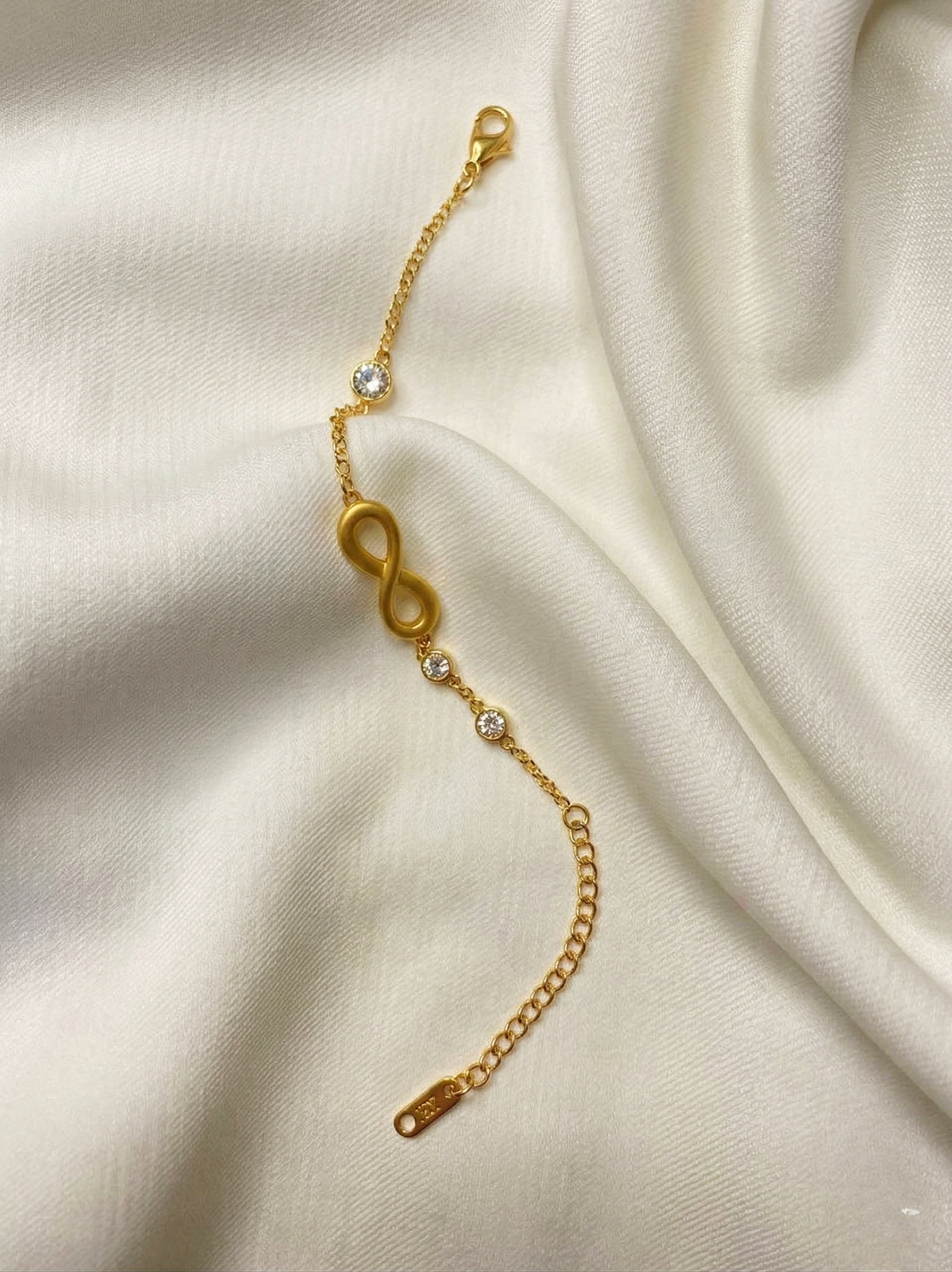 Prifine Infinity Wish Bracelet featuring a delicate silver infinity charm on a woven cord, suitable for everyday wear.