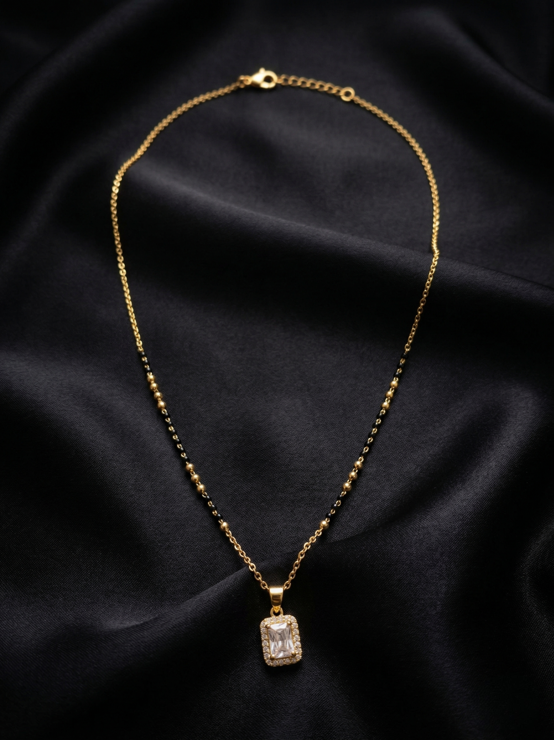 Prifine Suhana Mangalsutra featuring gold and black beads, traditional Indian jewelry with intricate design.