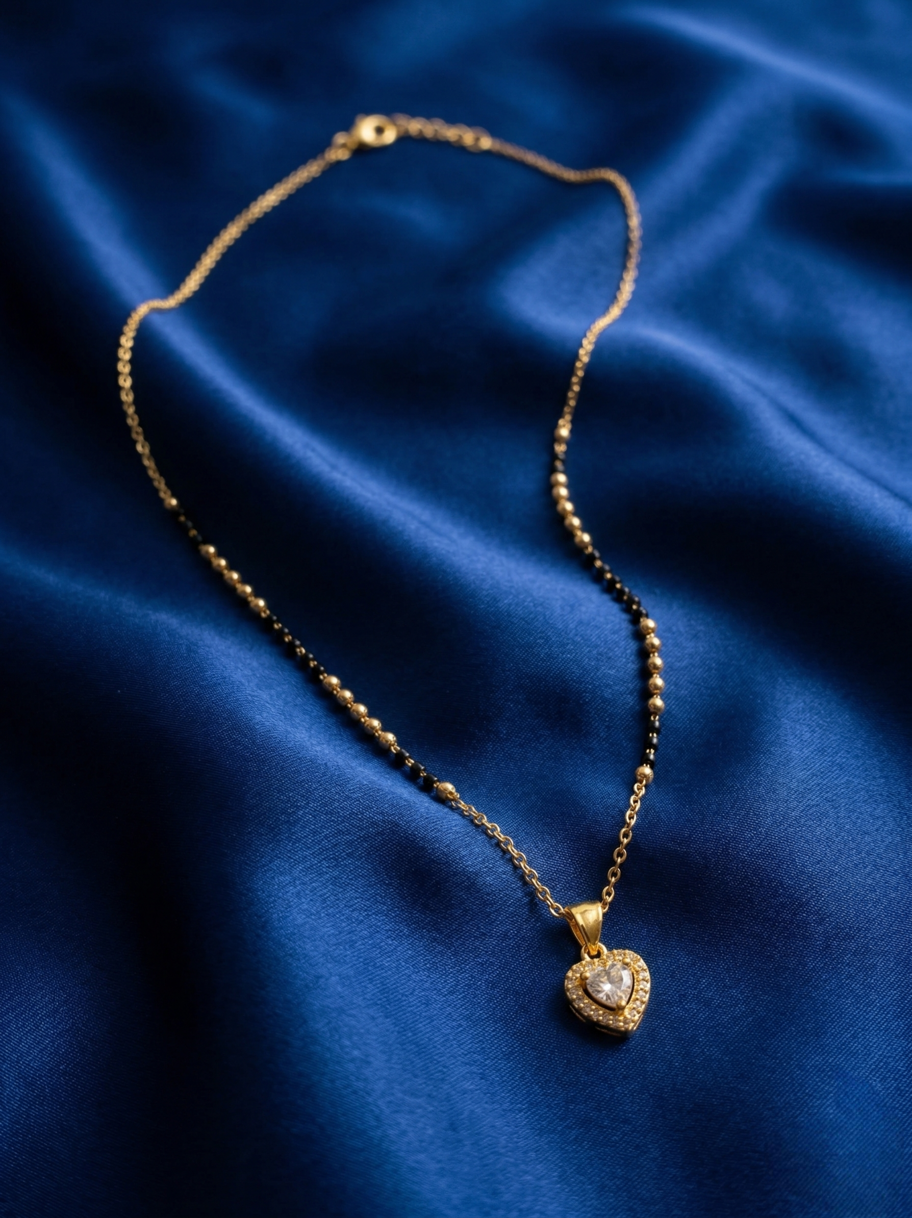 Prifine Luxe Senorita Mangalsutra featuring intricate gold design with black beads and traditional pendant for Indian bridal jewelry
