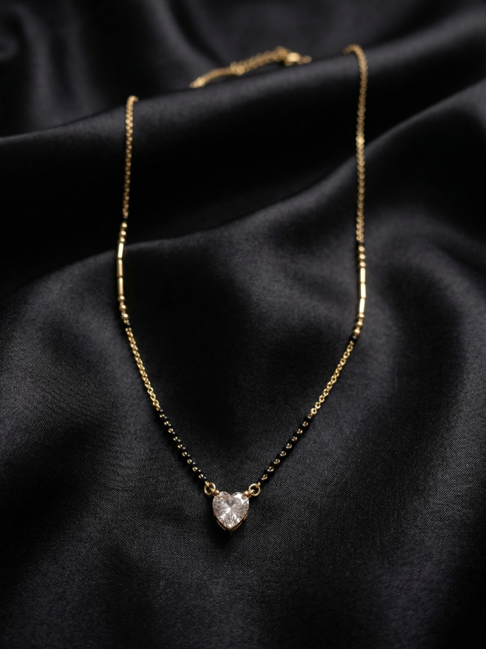 Prifine Shine Heart Mangalsutra with gold chain and pendant featuring a shining heart design, traditional Indian jewelry.