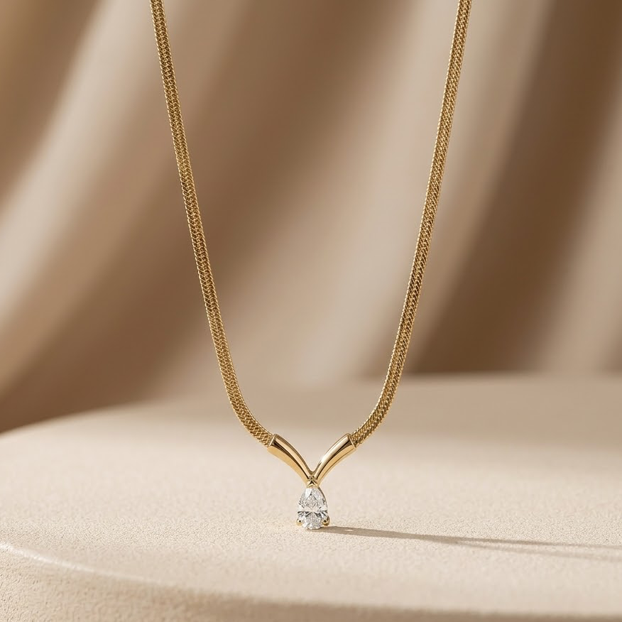Prifine 18k gold plated teardrop pendant herringbone necklace featuring a sleek, shiny chain with elegant teardrop charm.