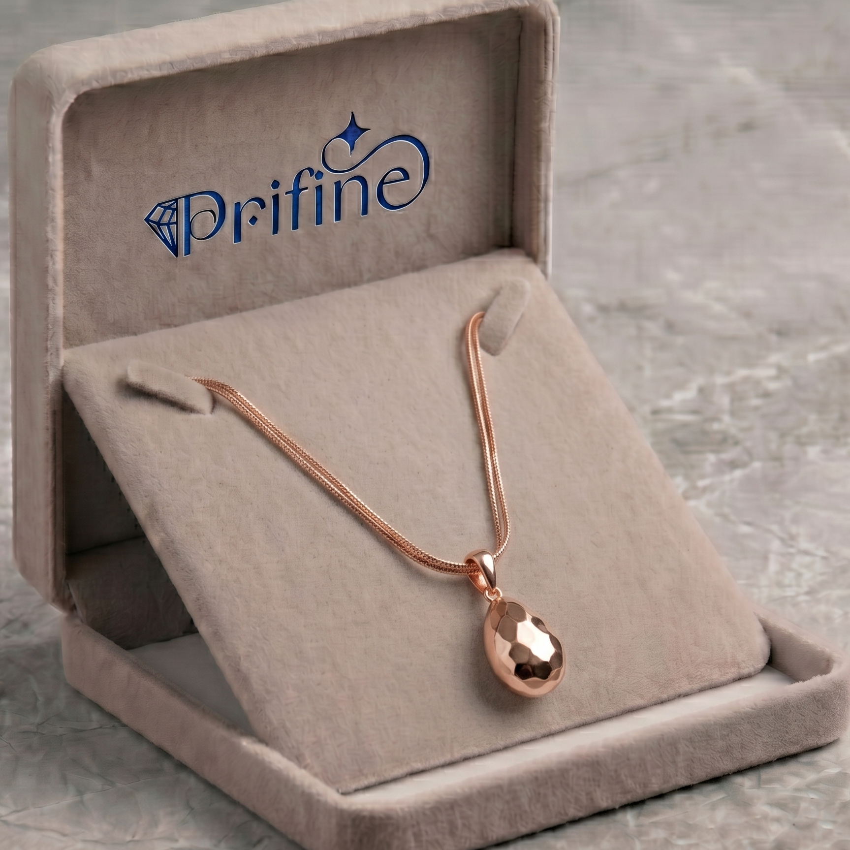 Rose gold hammered teardrop pendant necklace by Prifine, featuring a textured, elegant teardrop design on a delicate chain.