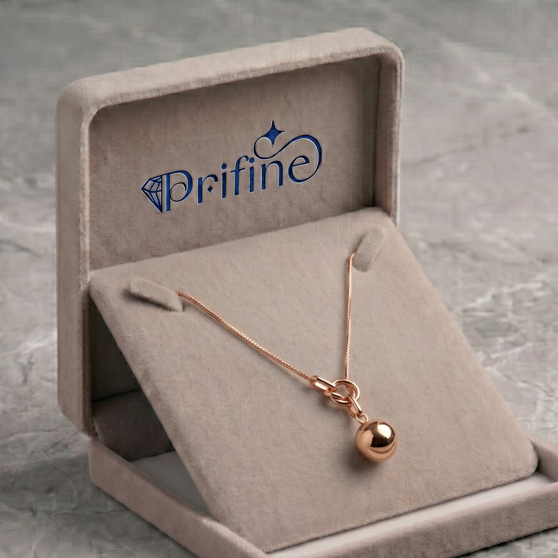 Prifine rose gold knot and sphere pendant necklace showcasing delicate jewelry with a polished finish on a white background.