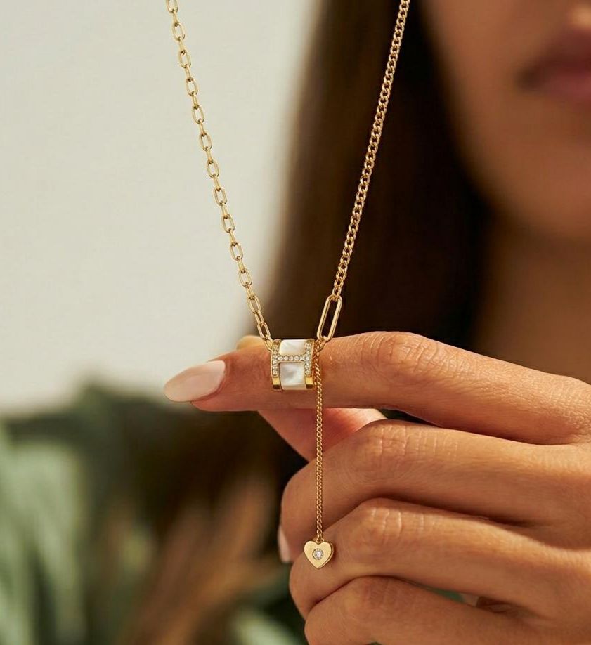 Gold adjustable slider necklace with heart charm from Prifine, featuring a sleek design and delicate pendant.