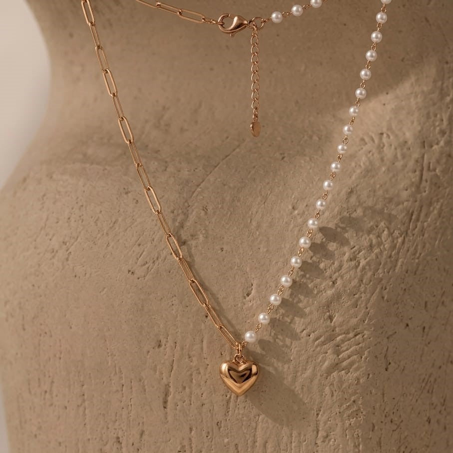 Dainty Prifine half pearl and paperclip heart necklace featuring a delicate chain and mixed metal design.