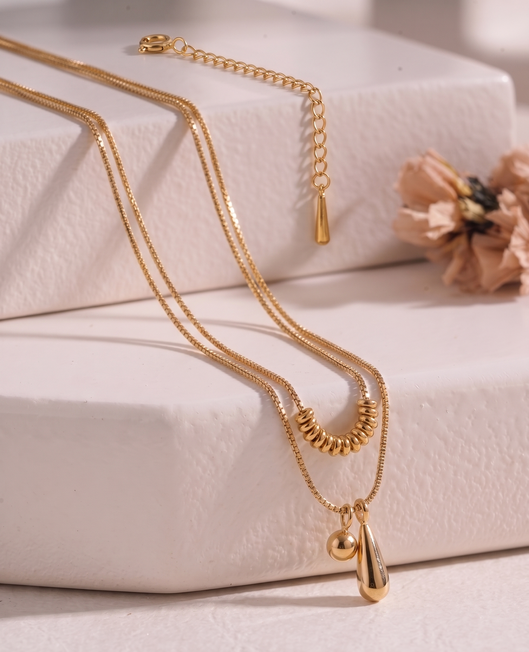 Gold geometric layering necklace set from Prifine Collection featuring multiple delicate chains and modern pendant designs.