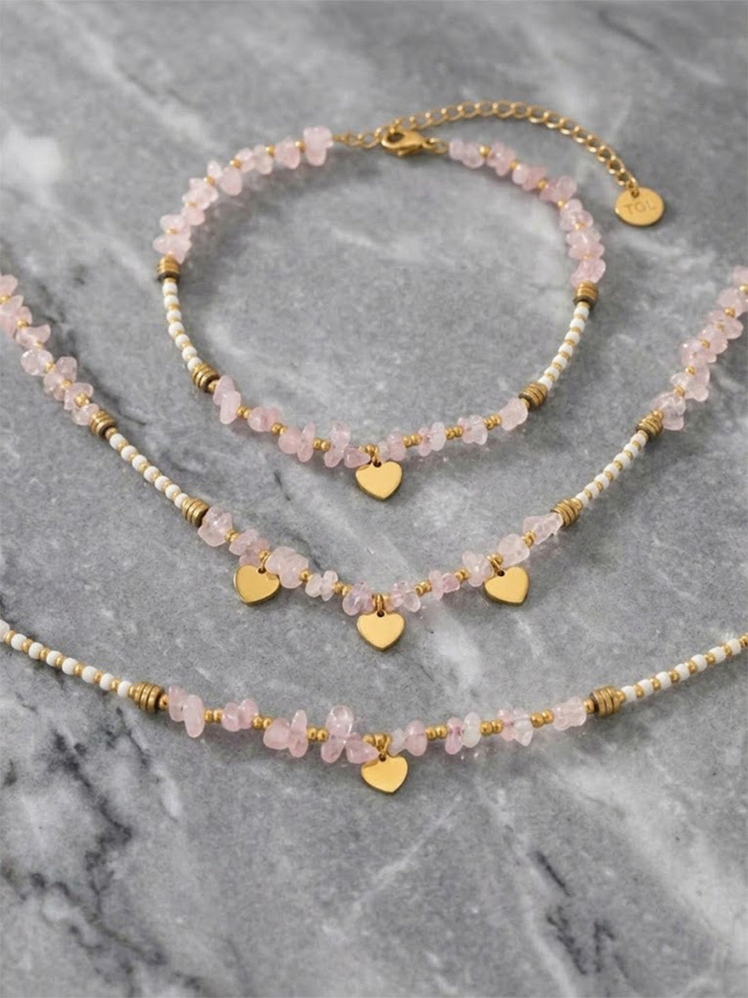 Prifine rose quartz heart charm jewelry set with gold-plated necklace, bracelet, and earrings featuring natural stone and waterproof design