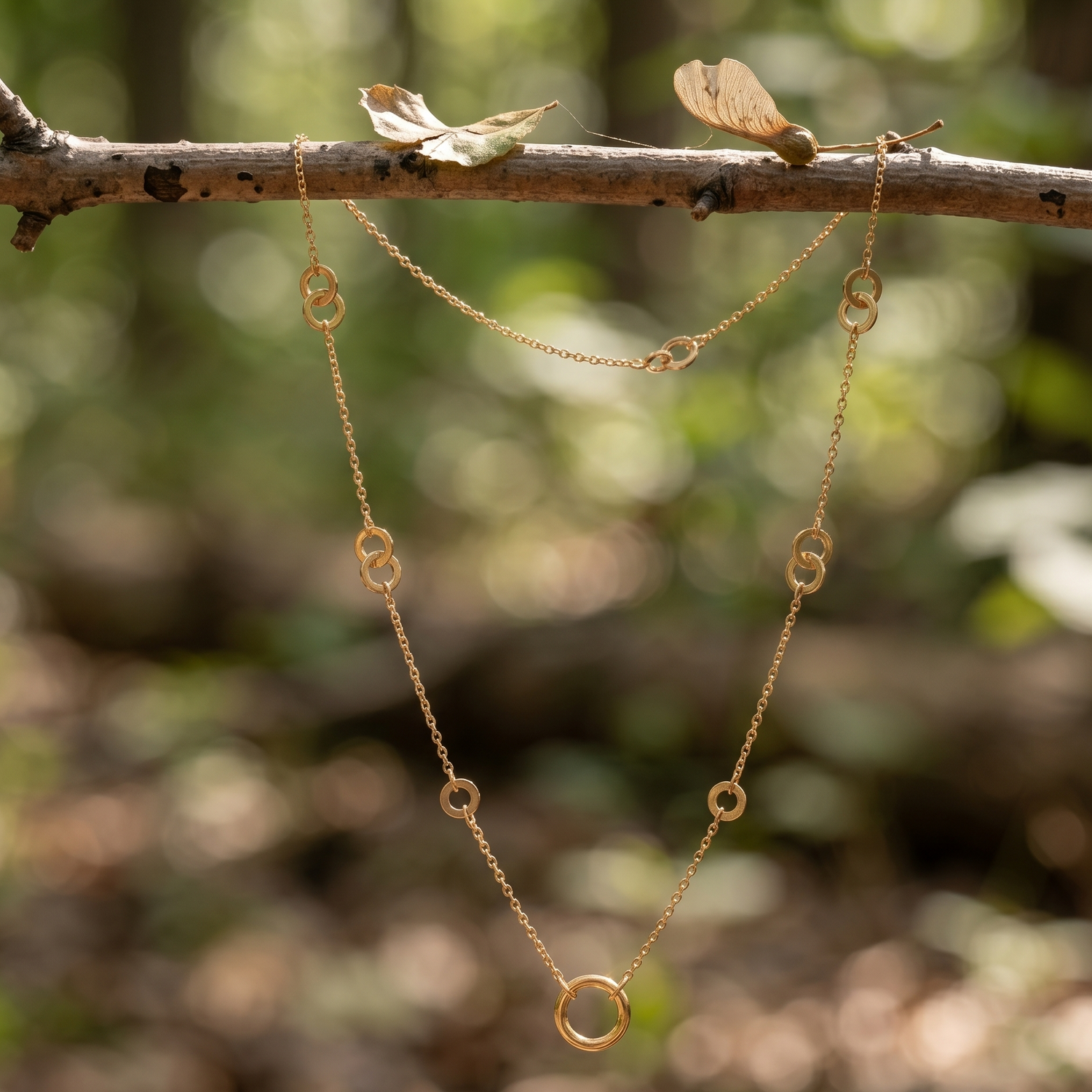 Prifine trendy minimal gold necklace featuring a circular charm, stylish jewelry accessory for everyday wear.