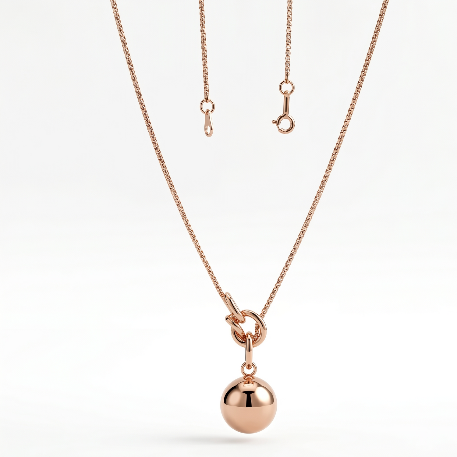 Rose gold knot and sphere pendant necklace by Prifine, showcasing a delicate jewelry piece with a polished, elegant finish.