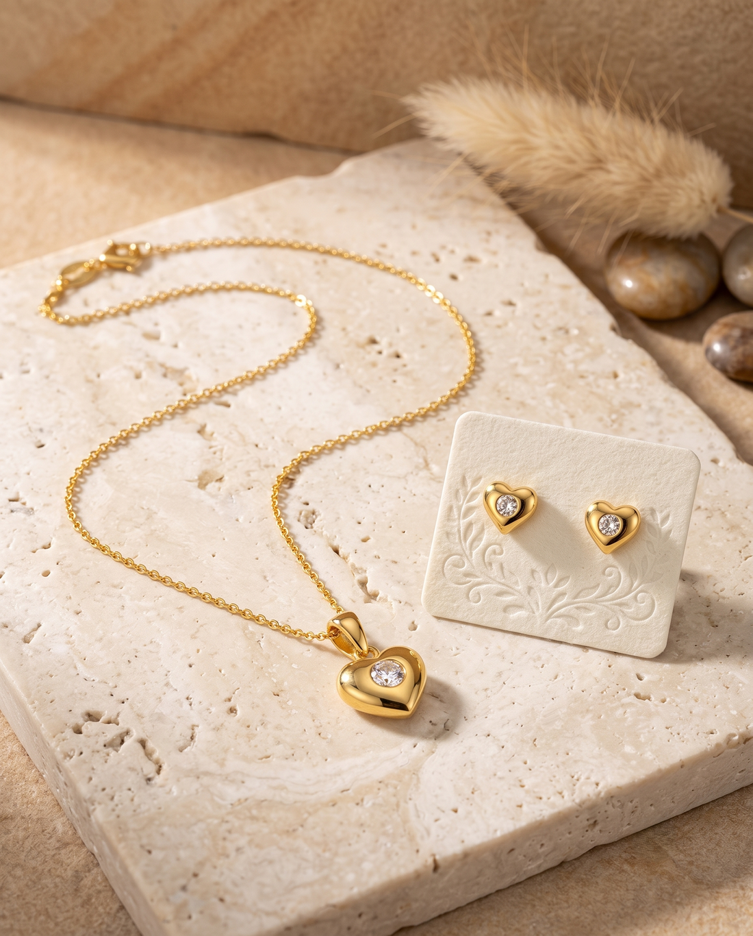 Prifine gold heart pendant necklace and stud earrings set for women featuring crystal accents and gold-plated jewelry.