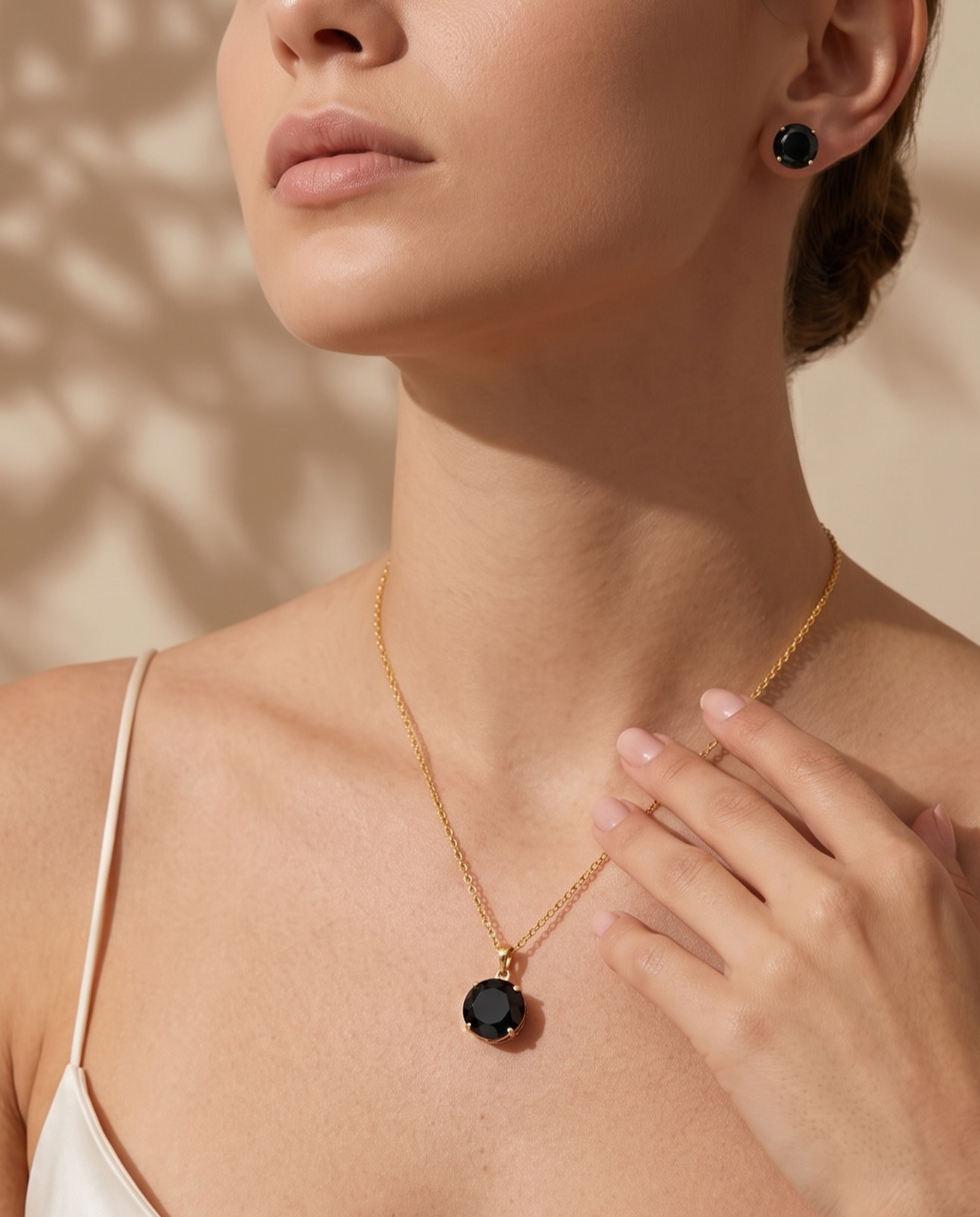 Prifine black crystal pendant necklace and stud earrings set for women, gold-plated elegant jewelry with sparkling black crystals.