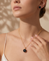 Prifine black crystal pendant necklace and stud earrings set for women, gold-plated elegant jewelry with sparkling black crystals.