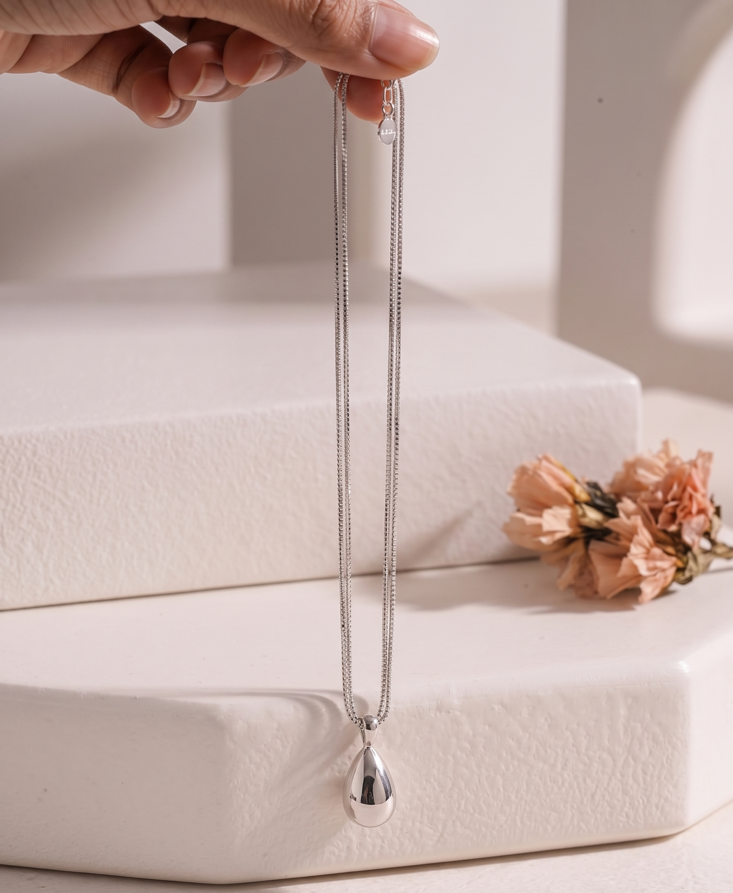 Silver-tone smooth teardrop double-strand necklace by Prifine, featuring elegant teardrop-shaped pendants on layered chains.