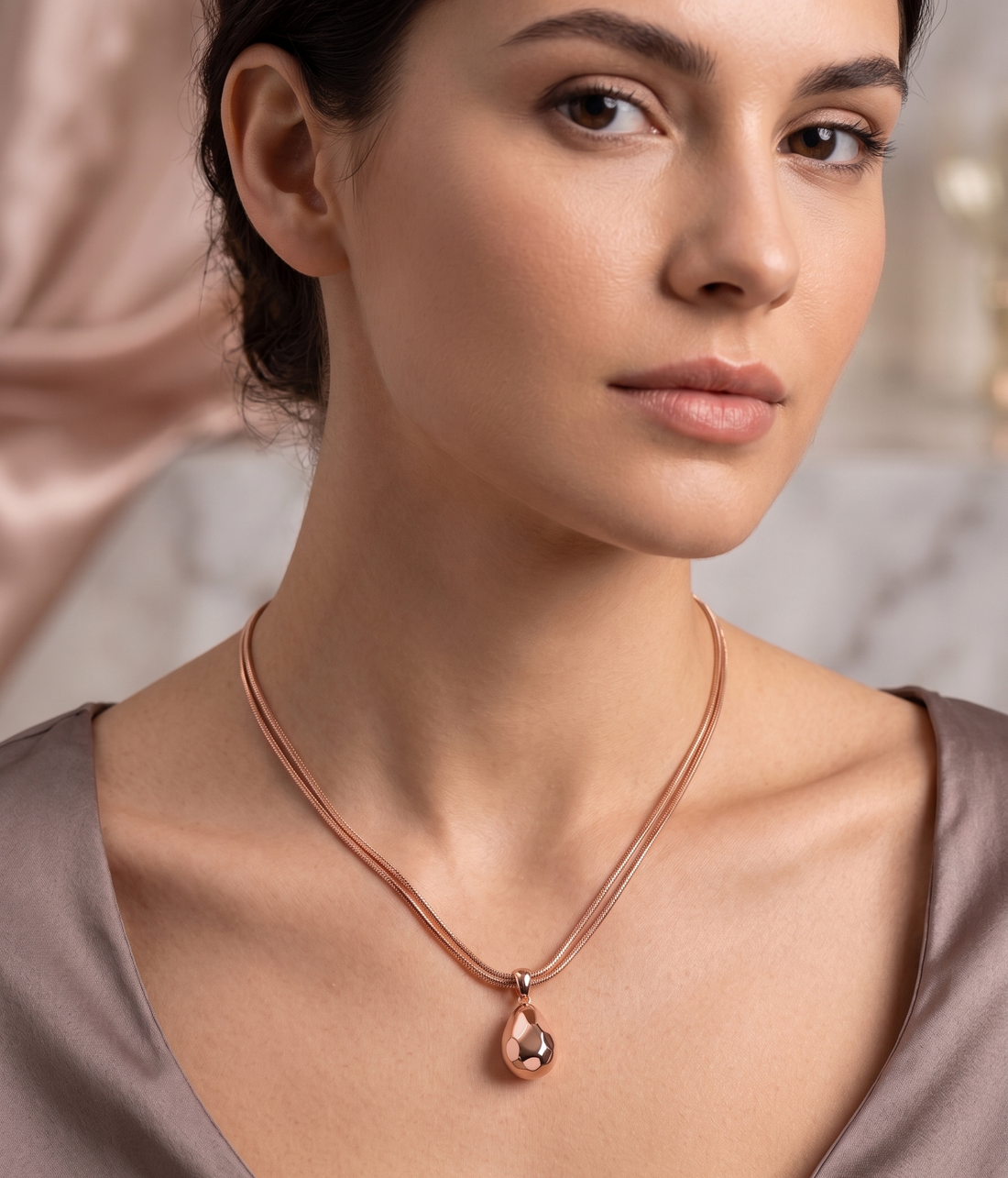 Rose gold hammered teardrop pendant necklace by Prifine, featuring a textured, shiny teardrop charm on a delicate chain.
