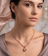 Rose gold hammered teardrop pendant necklace by Prifine, featuring a textured, shiny teardrop charm on a delicate chain.