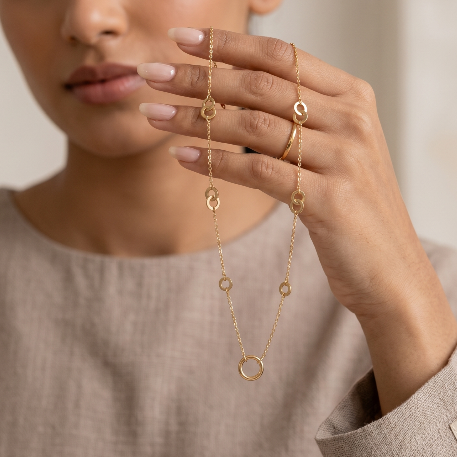 Prifine trendy minimal gold necklace with a circular charm, featuring a delicate chain and sleek jewelry design.