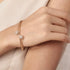 Prifine twin sphere open bangle in 18K gold plating, featuring two spherical accents on a sleek, open bracelet design.