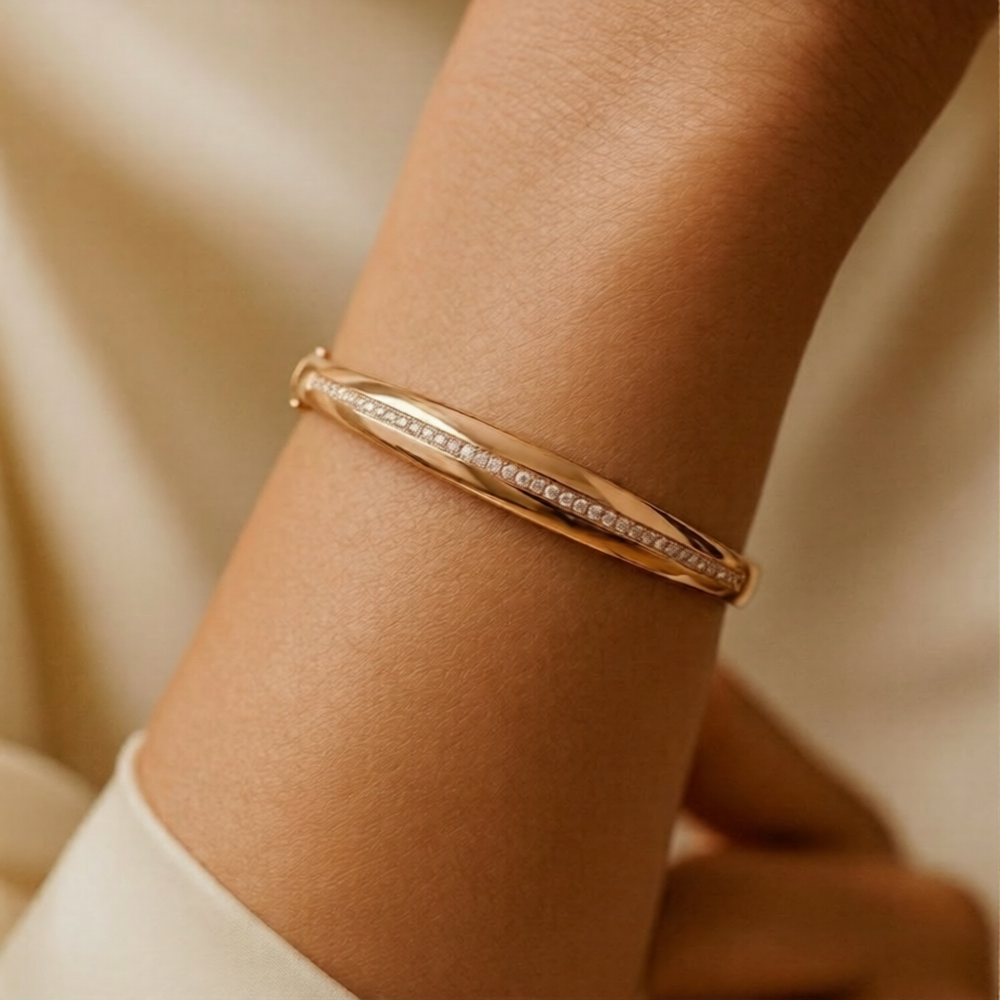 Prifine twisted ribbon pave bracelet in 18K gold plated sculptural cuff design, featuring intricate detailing and elegant craftsmanship.