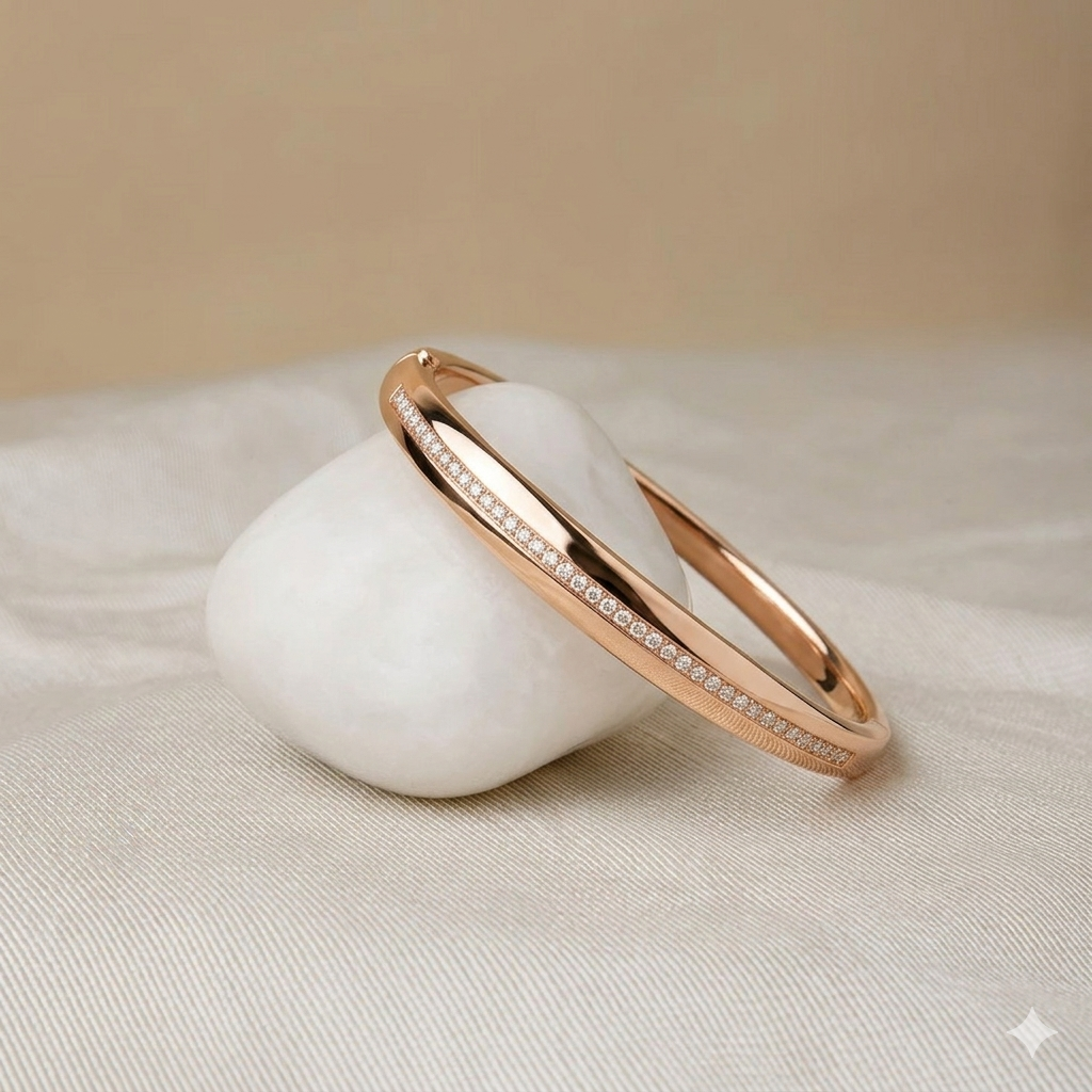 Prifine Twisted Ribbon Pave Bracelet in 18K gold plating, showcasing a sculptural, elegant cuff design with sparkling pave accents.