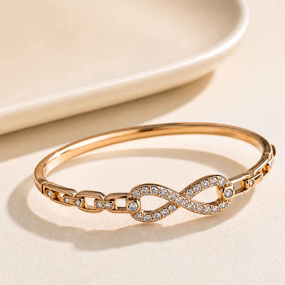 Prifine Eternal Infinity Pave Bangle in 18K gold plated link bracelet with sparkling pave detailing on a white background.