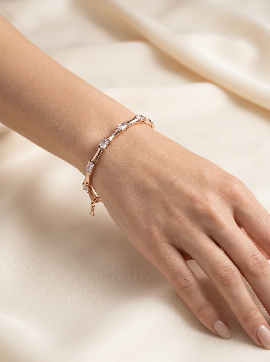 18k gold-plated mixed geometric station bracelet by Prifine featuring various shaped links on a white background