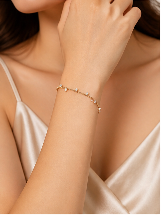 18k gold-plated celestial station bracelet by Prifine featuring star and moon charms on a delicate chain.