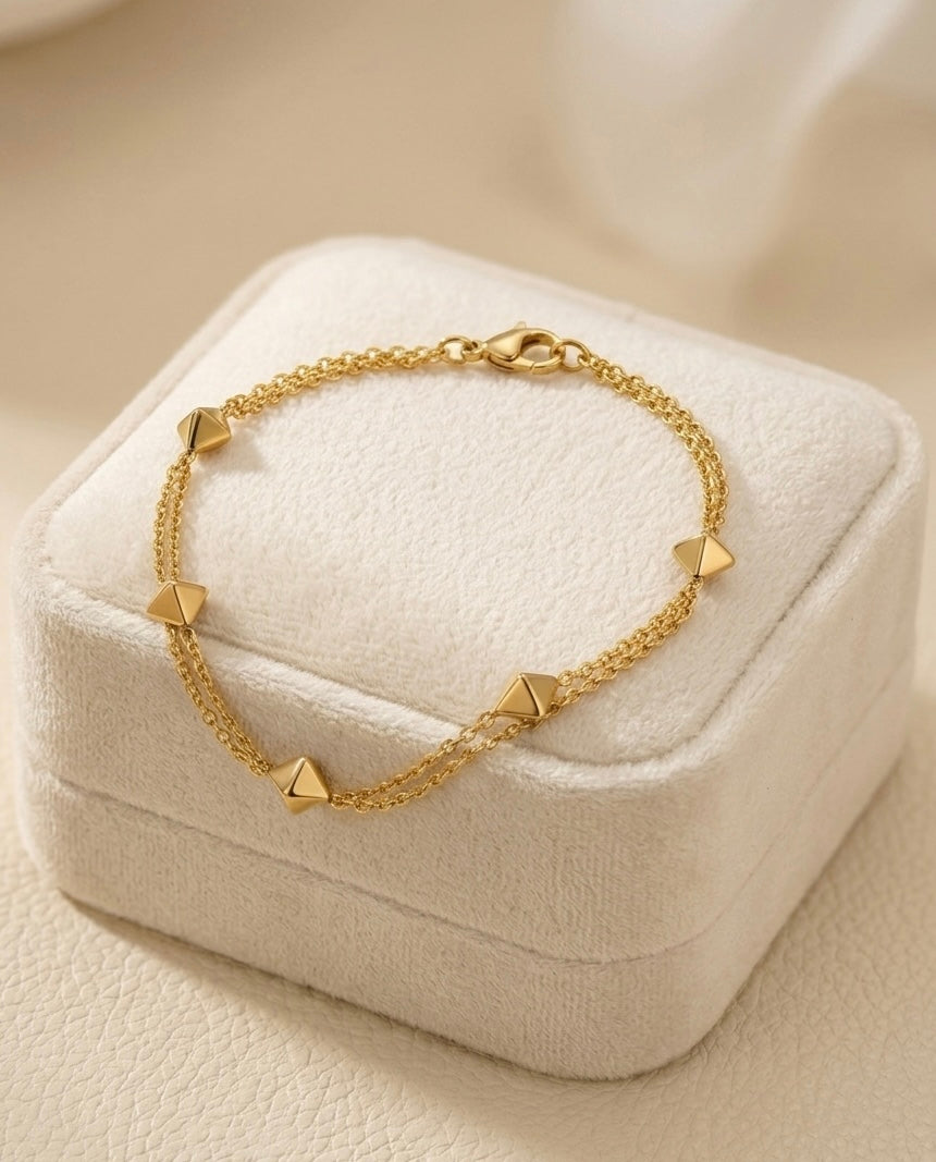 Prifine 18k gold-plated geo stud station bracelet with geometric design and delicate chain for stylish jewelry wear.