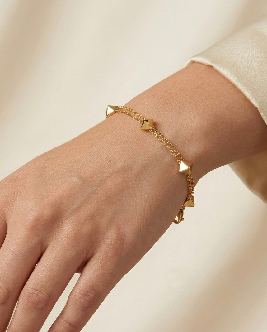 Prifine 18k gold-plated geo stud station bracelet with geometric design, featuring alternating gold geometric shapes on a delicate chain.