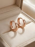 Prifine classic rose gold hoop earrings with a smooth, polished finish and medium size, displayed on a neutral background.
