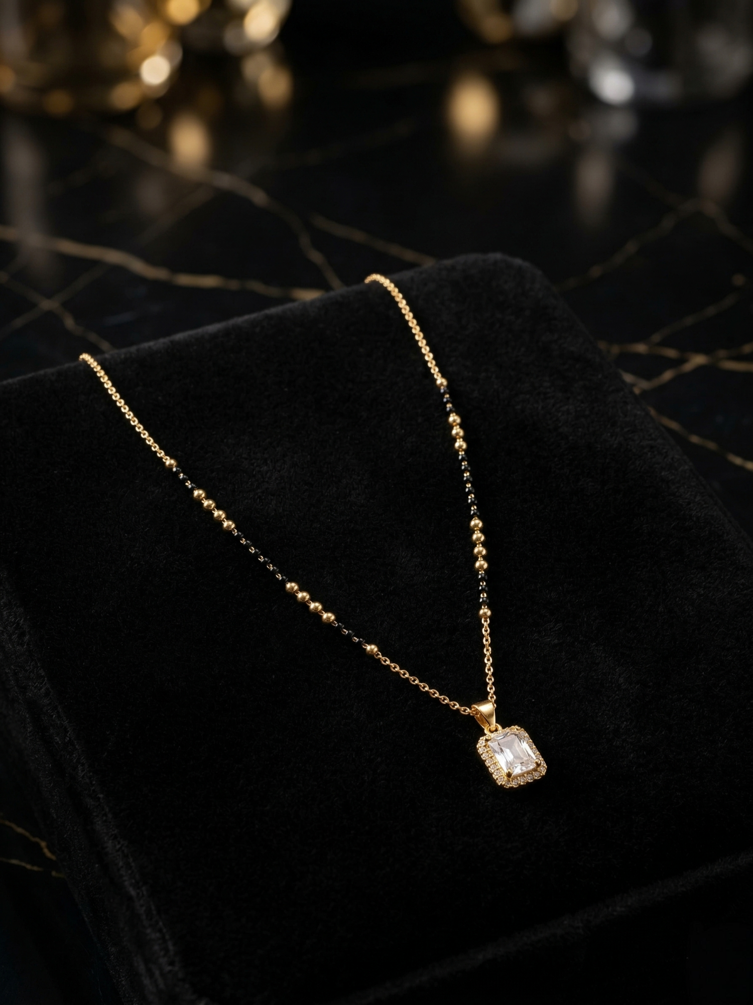 Prifine Suhana Mangalsutra with gold and black bead design, featuring traditional pendant and intricate chain detailing.