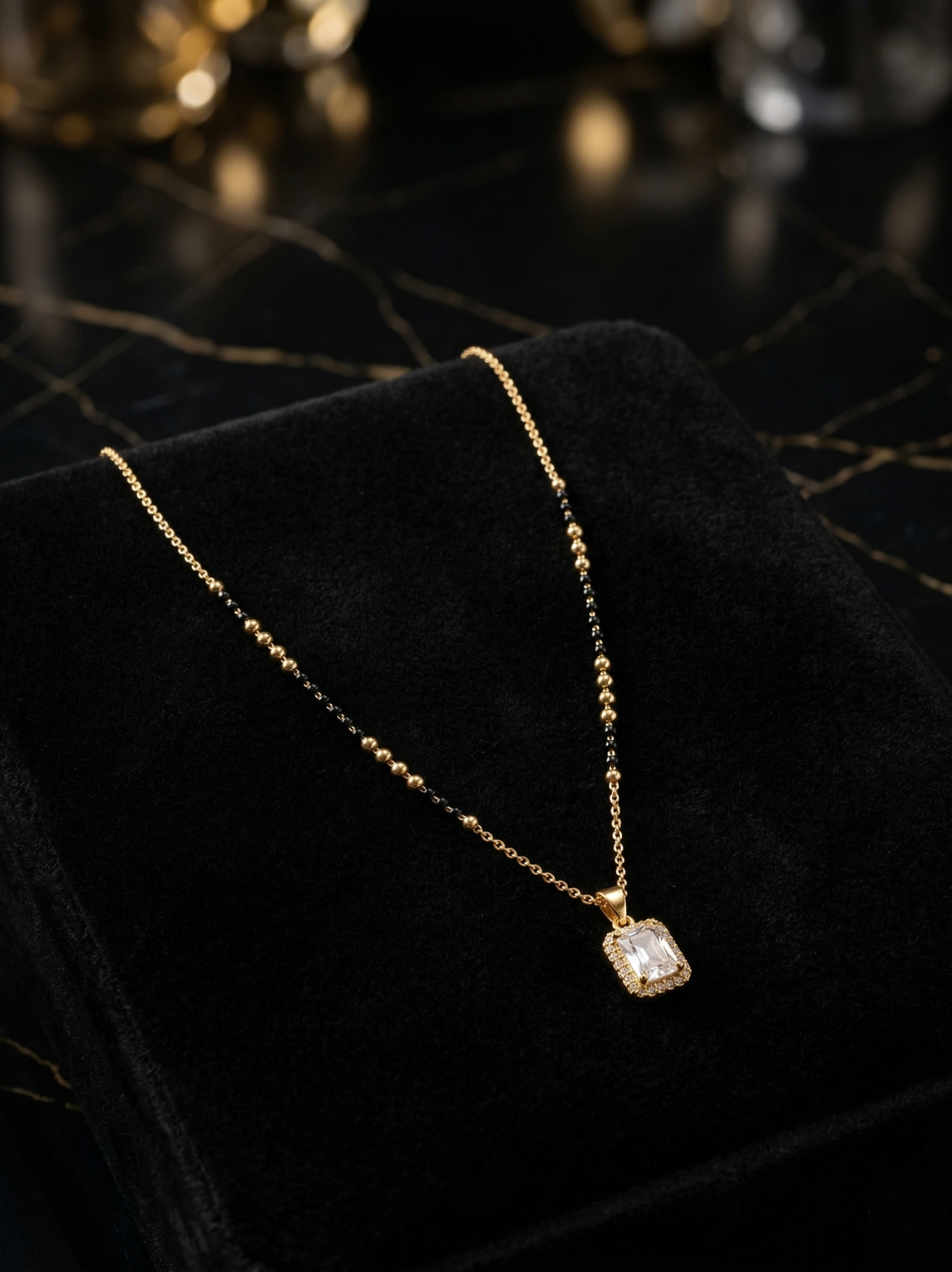 Prifine Suhana Mangalsutra with gold and black bead design, featuring traditional pendant and intricate chain detailing.