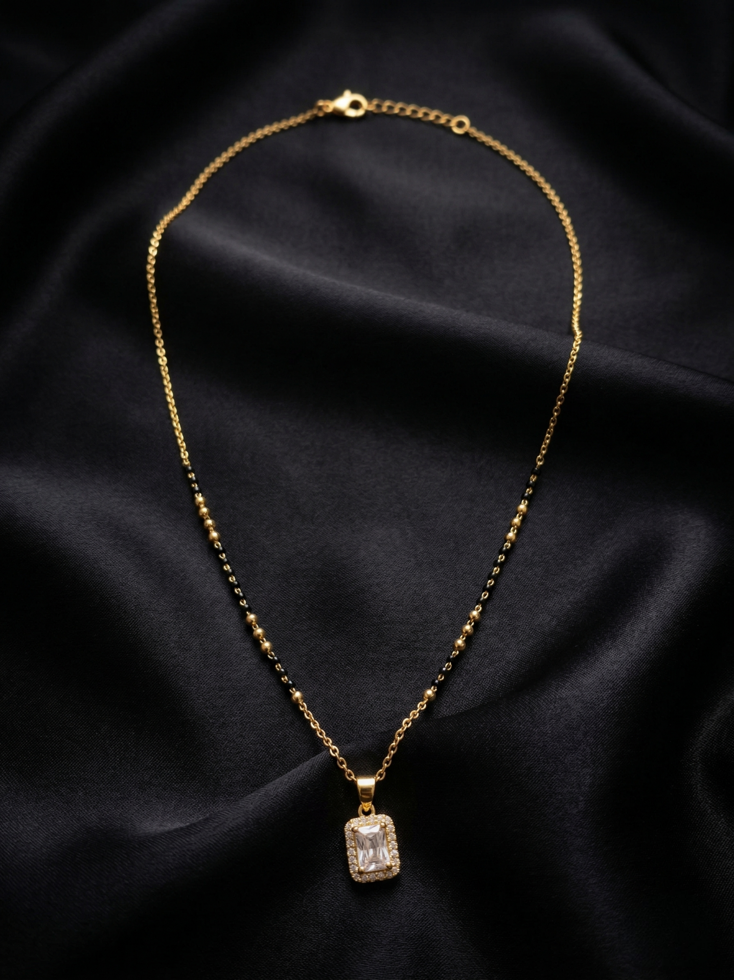 Prifine Suhana Mangalsutra featuring gold and black beads, traditional Indian jewelry with intricate design.
