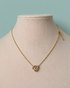 Prifine Golden Heart Duo Pendant Necklace featuring two intertwined heart-shaped pendants on a delicate chain.