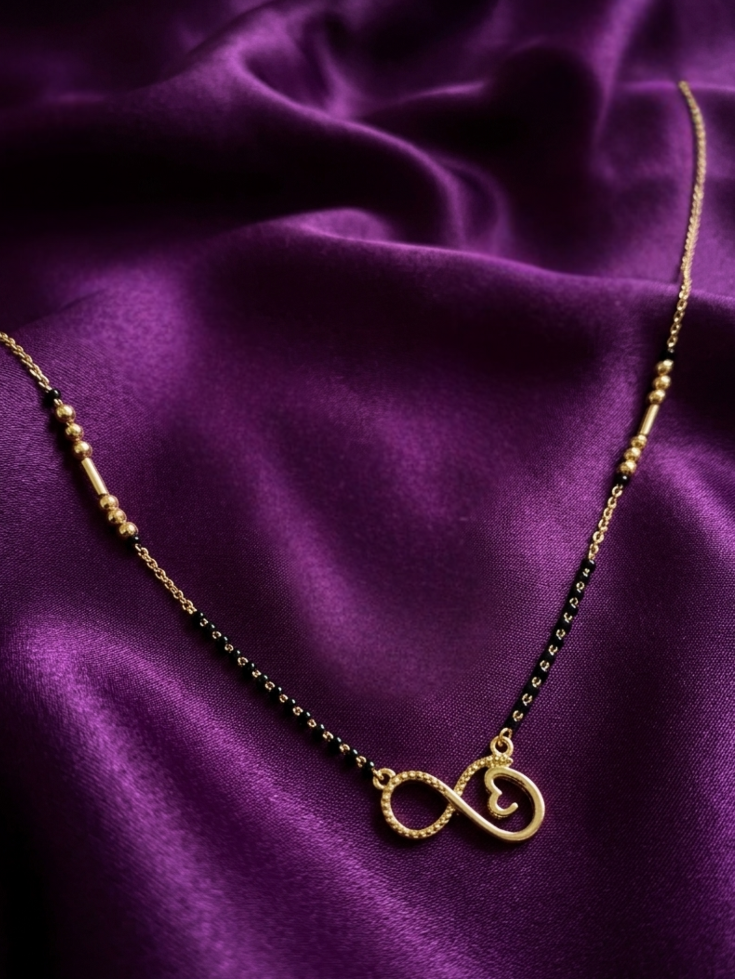Prifine Infinity Mangalsutra featuring a gold chain with infinity pendant, traditional Indian jewelry for auspicious occasions.