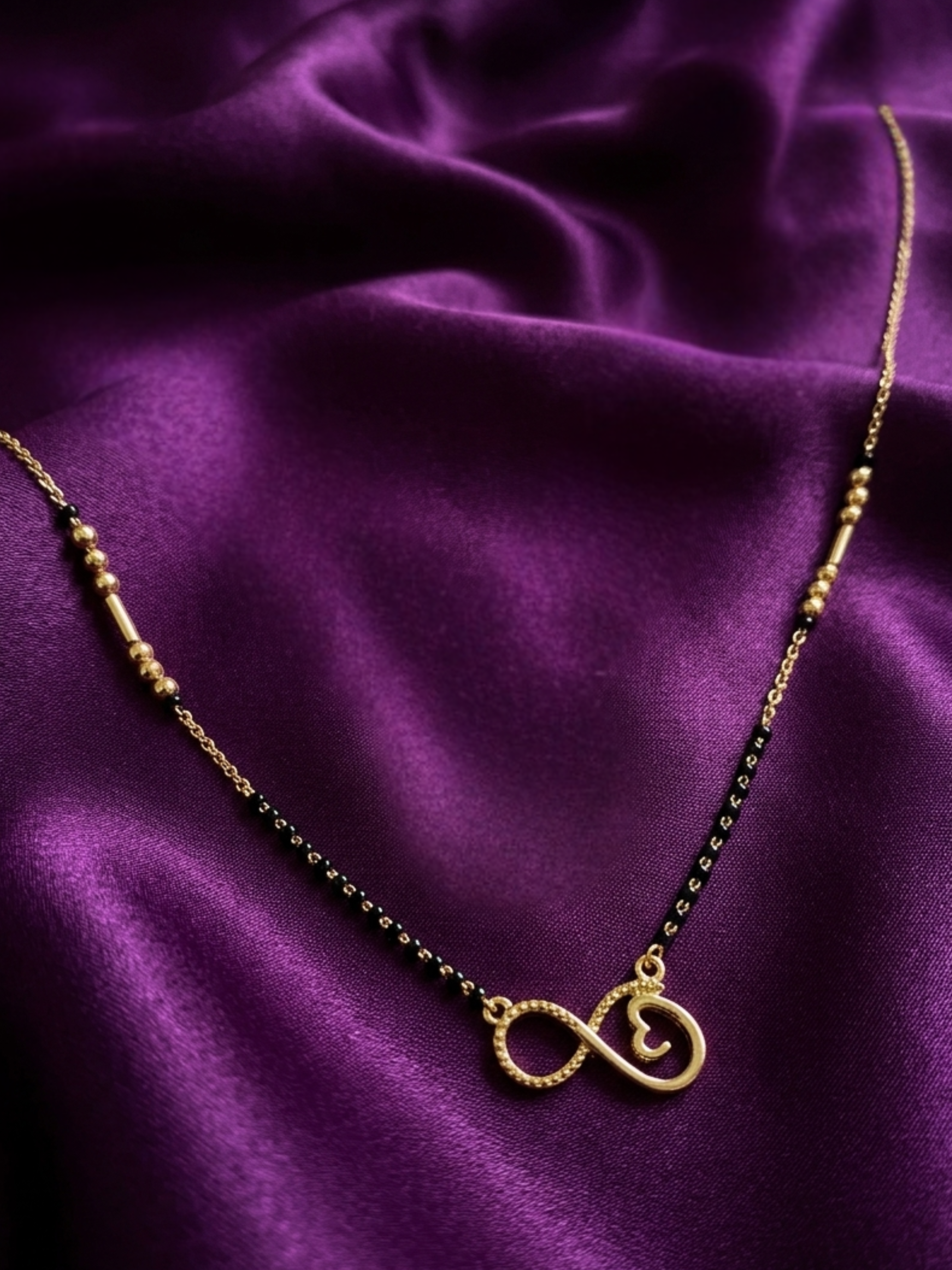 Prifine Infinity Mangalsutra featuring a gold chain with infinity pendant, traditional Indian jewelry for auspicious occasions.
