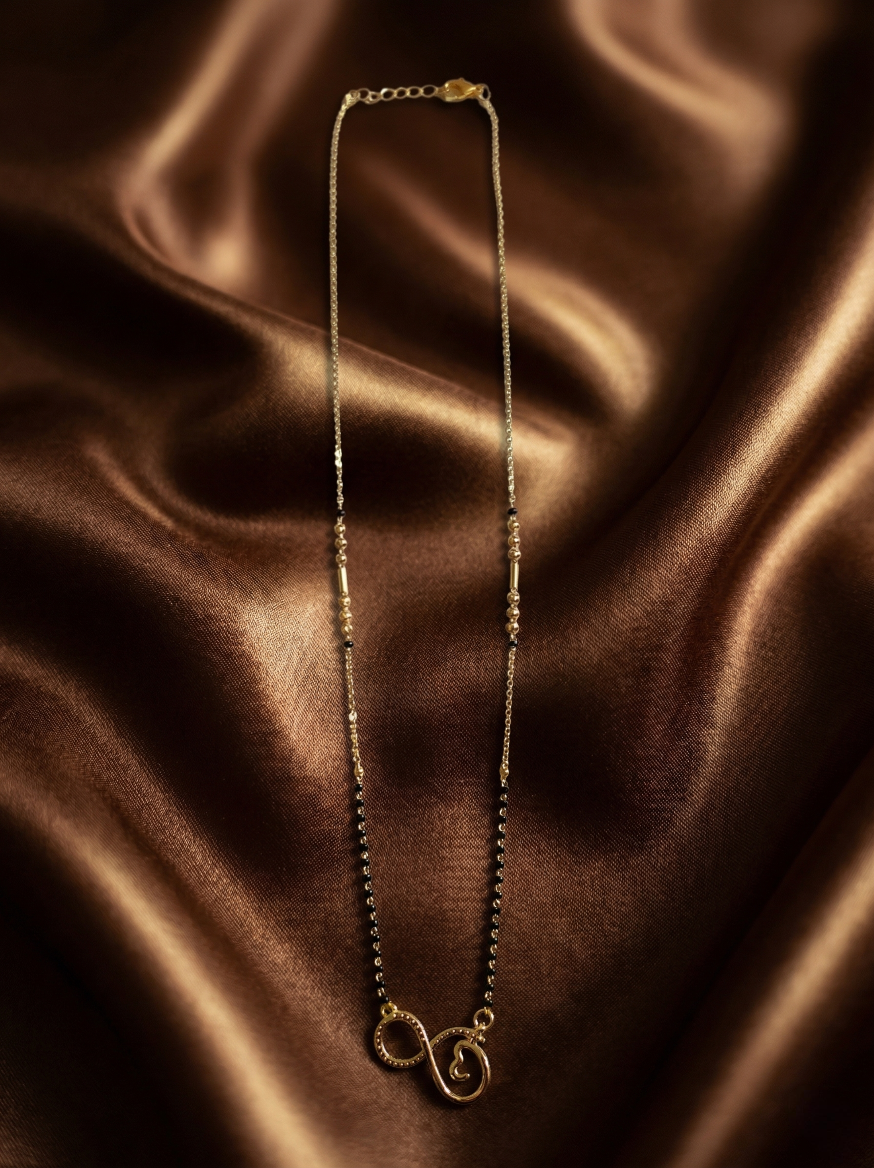 Prifine Infinity Mangalsutra featuring a delicate chain with infinity pendant, traditional jewelry for special occasions.
