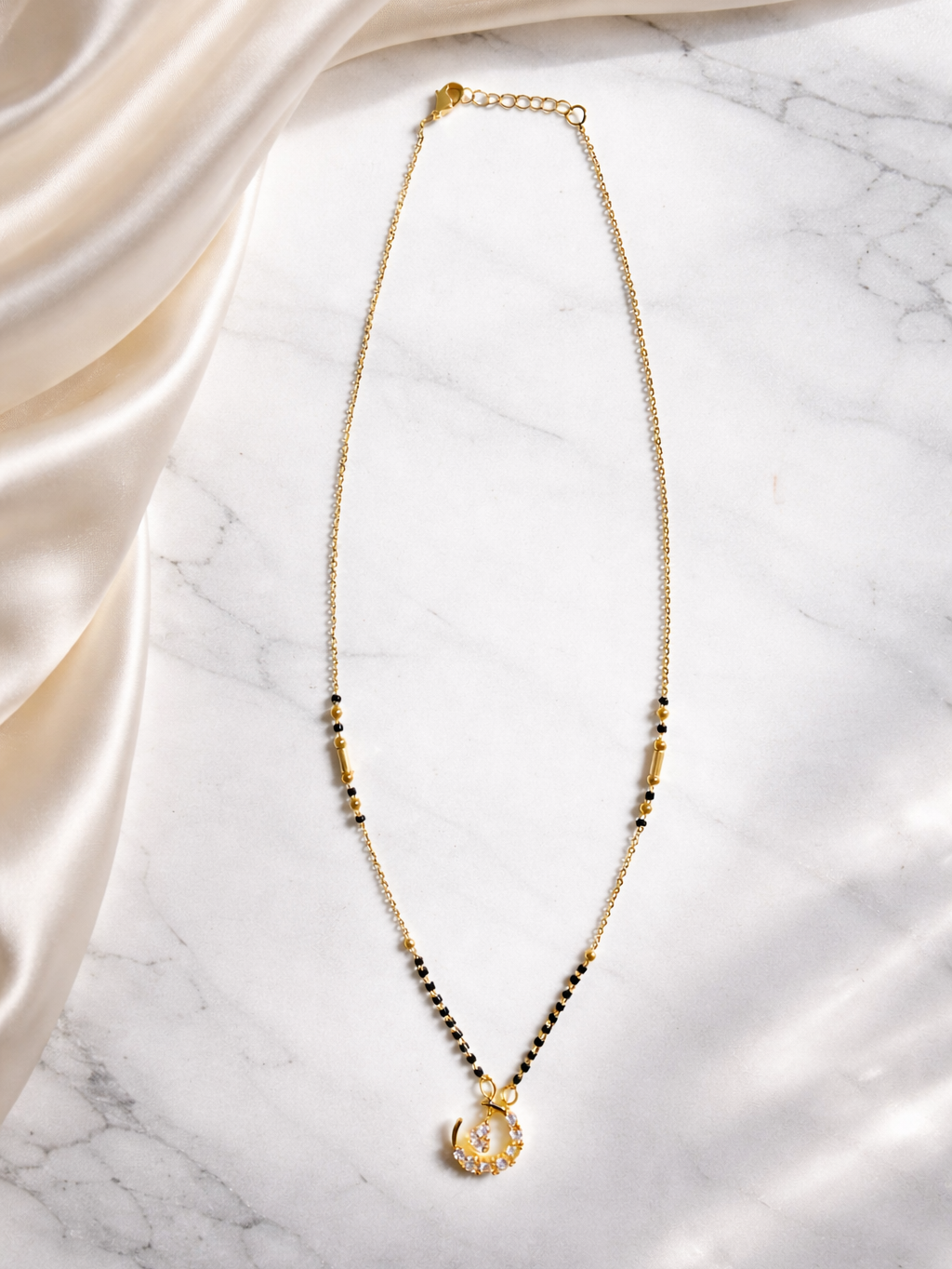 Prifine Moonlight Spark Mangalsutra with intricate gold chain and pendant, showcasing elegant Indian jewelry design.