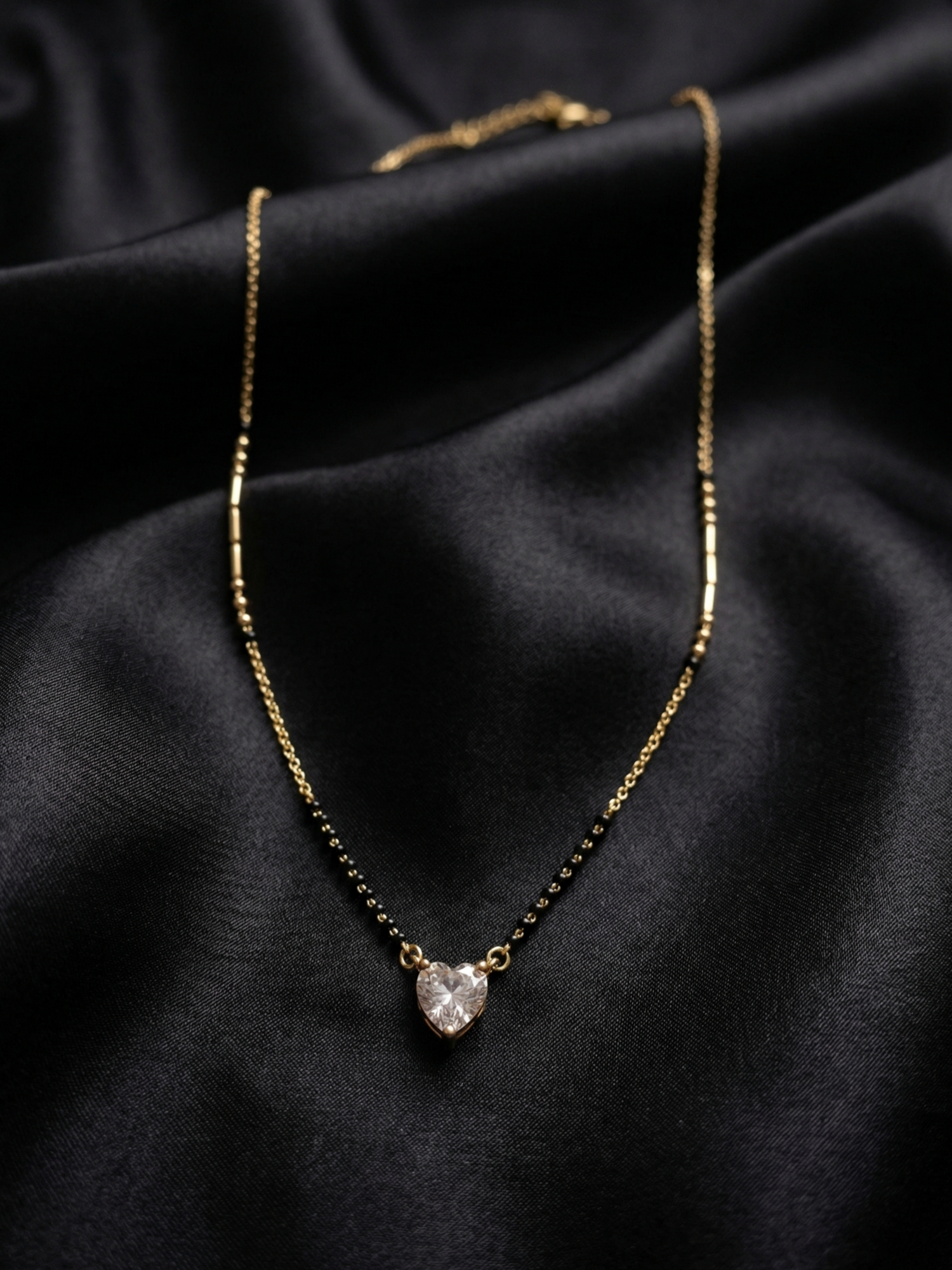 Prifine Shine Heart Mangalsutra with gold chain and pendant featuring a shining heart design, traditional Indian jewelry.