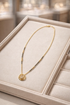 Golden Dew Mangalsutra by Prifine featuring a delicate gold chain with a traditional pendant design.