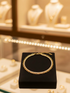 Prifine three-layered gold bracelet with delicate chains and elegant design, perfect for stylish wrist accessorizing.