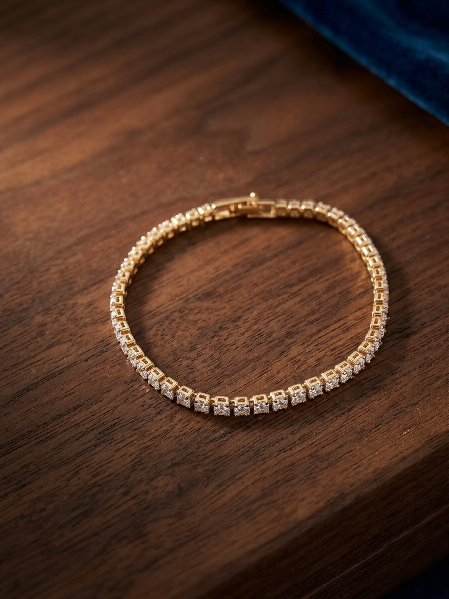 Prifine Gold Radiance Tennis Bracelet featuring sparkling gold links and elegant design on a white background.