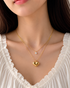Gold tone layered heart pendant necklace by Prifine, featuring multiple heart charms and delicate chain details.